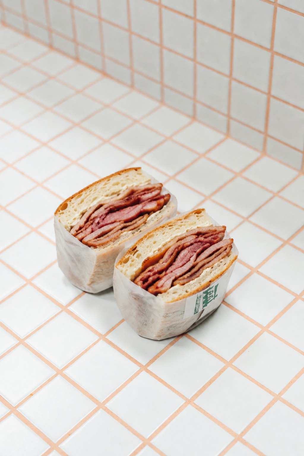Bacon butty sandwich wrapped in paper